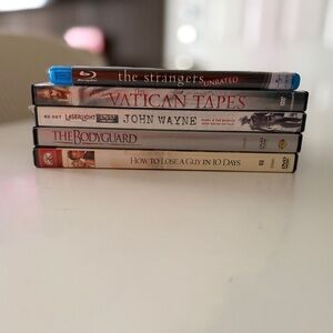 Blu-ray and DVD Collection with Blue and Black Cases